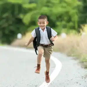 Chiropractic Austin TX Child Walking Home From School